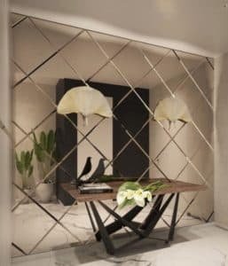 Hall de entrada e parede revestida de espelho losangos bronze